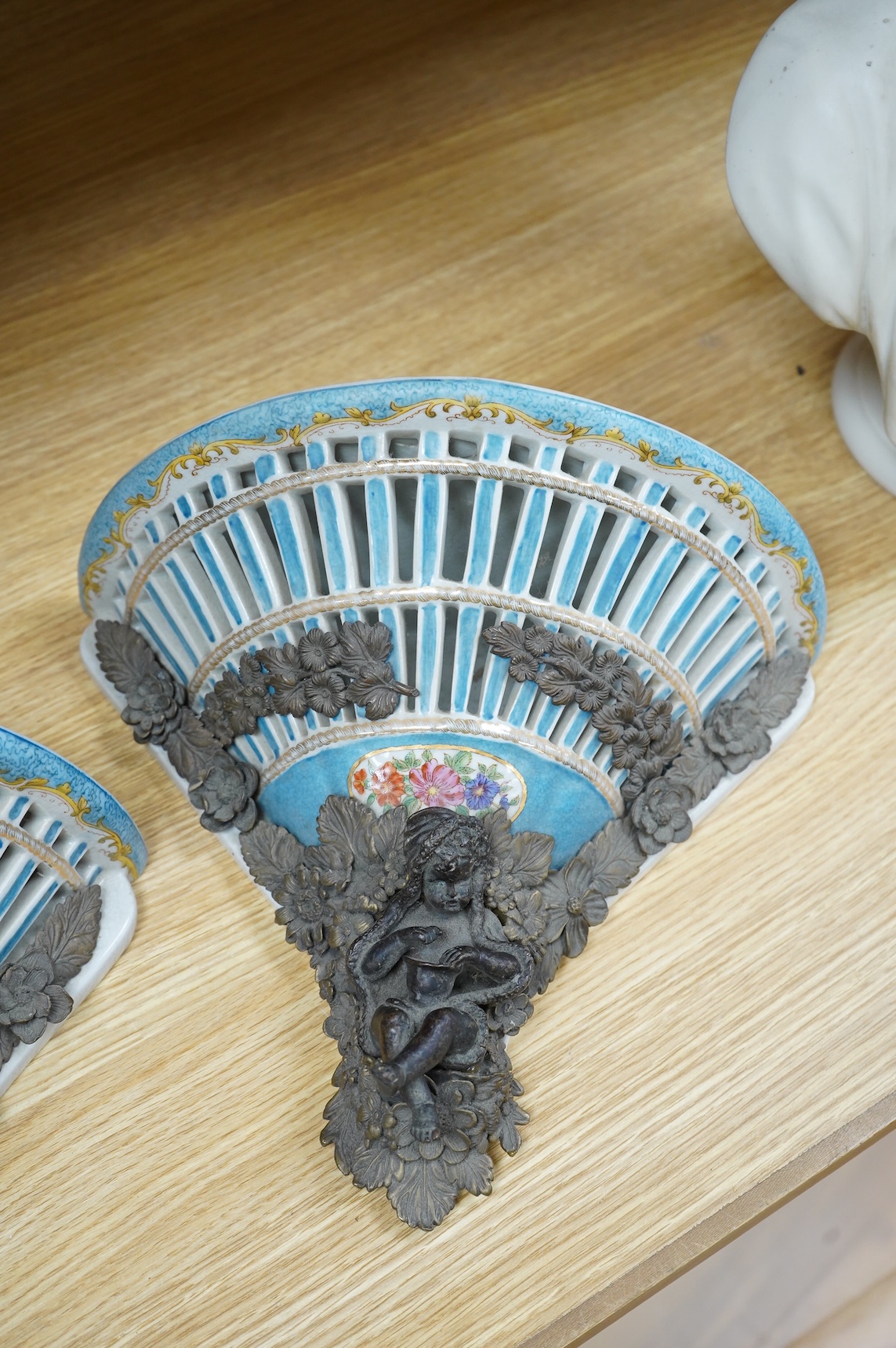 A pair of Sevres style pierced ceramic brackets with bronze mounts, 26 x 31cm